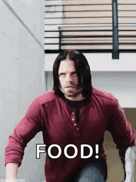 a man in a red shirt is running down a set of stairs with the word food .