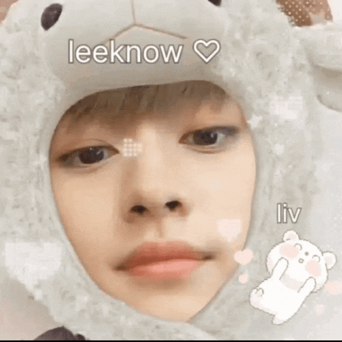 a close up of a person wearing a sheep hat