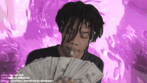 a man is holding a bunch of money and smoking a cigarette