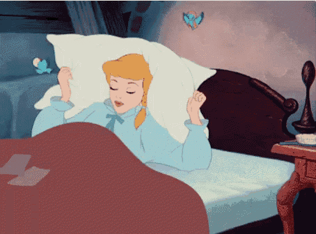 a cartoon of cinderella laying in bed with her eyes closed