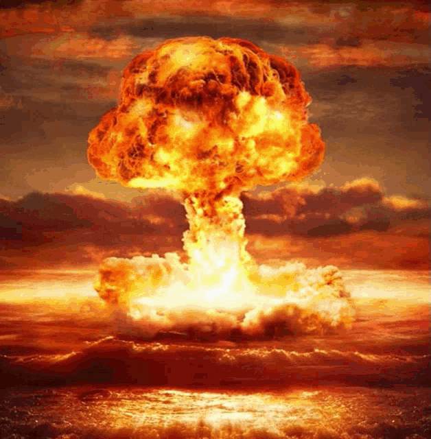 a large mushroom cloud is coming out of the water