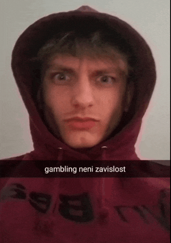 a man wearing a red hoodie with the word gambling written on it