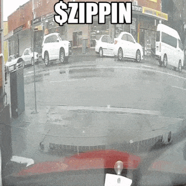 a white van is parked on the side of the road in front of a building that says $ zippin