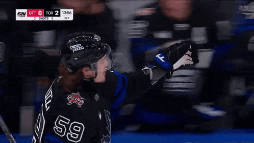 a hockey player with the number 59 on their jersey