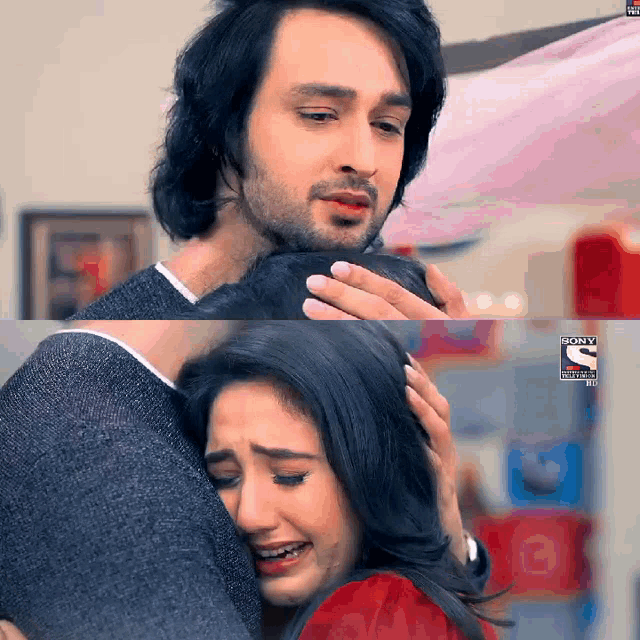 a man is hugging a woman who is crying and the letters s on the bottom right