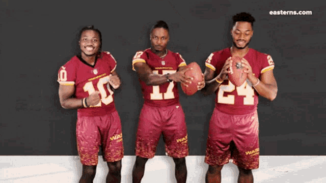 three washington redskins football players pose for a photo