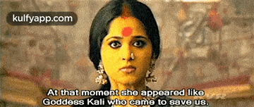 a woman with a red dot on her forehead is talking about goddess kali who came to save us .