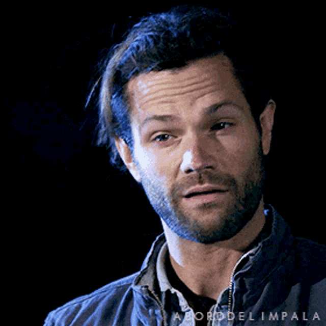 a close up of a man 's face with the words borddel impala on the bottom right