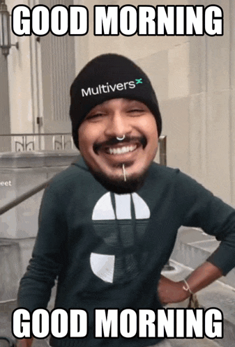 a man wearing a beanie that says multiverse on it says good morning