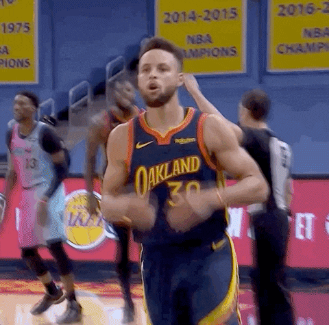 a basketball player wearing a jersey that says oakland on it