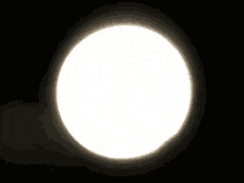 a crescent moon is visible in the dark sky