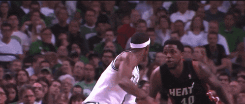a basketball player with the number 4 on his jersey is dribbling the ball