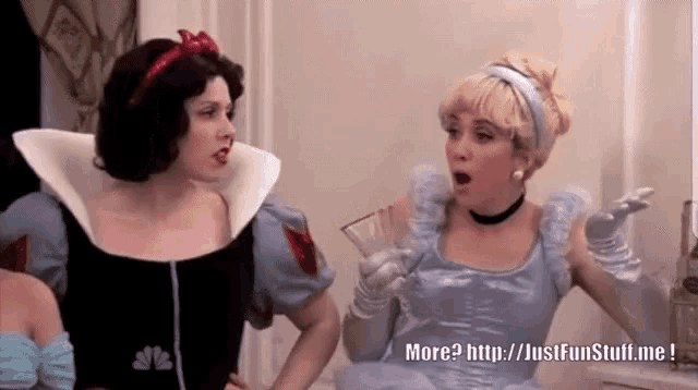 snow white and cinderella are standing next to each other