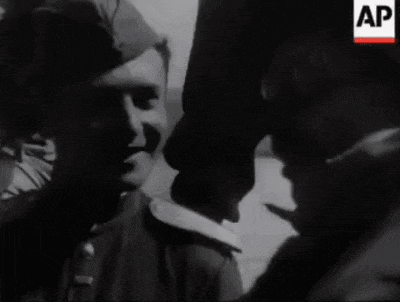 a black and white photo of two men with the letters ap on the bottom