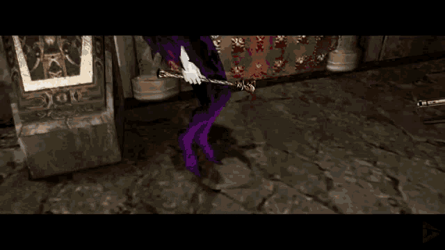 a person is holding a gun and a bullet is flying out of it .