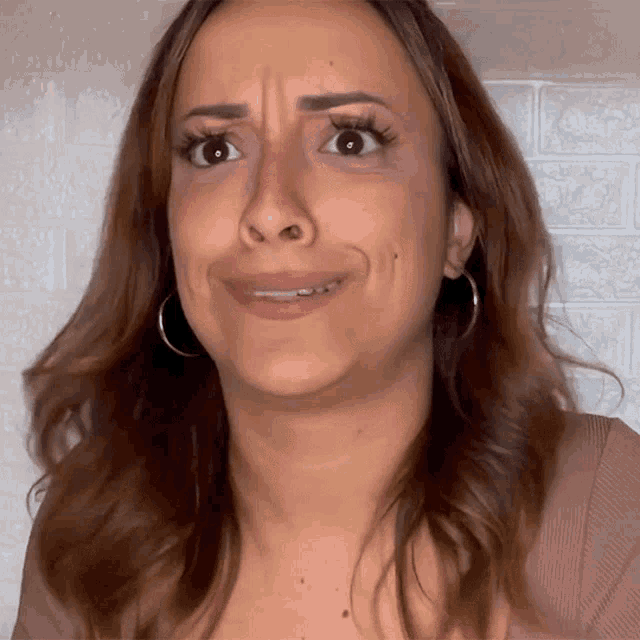 a woman is making a funny face with her mouth open
