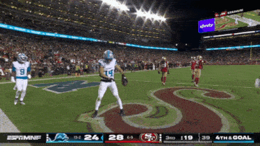 a football game between the san francisco 49ers and the detroit lions is being shown on espn