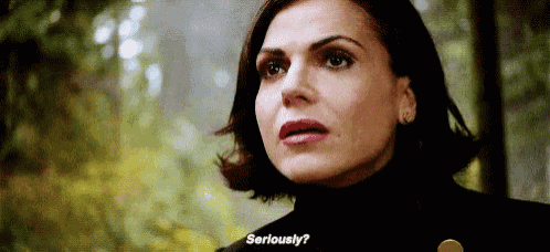 a close up of a woman 's face with the words `` seriously '' written on her mouth .