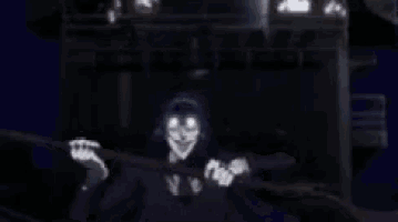 a man in a purple suit and white gloves is standing in the dark with his hands in the air .