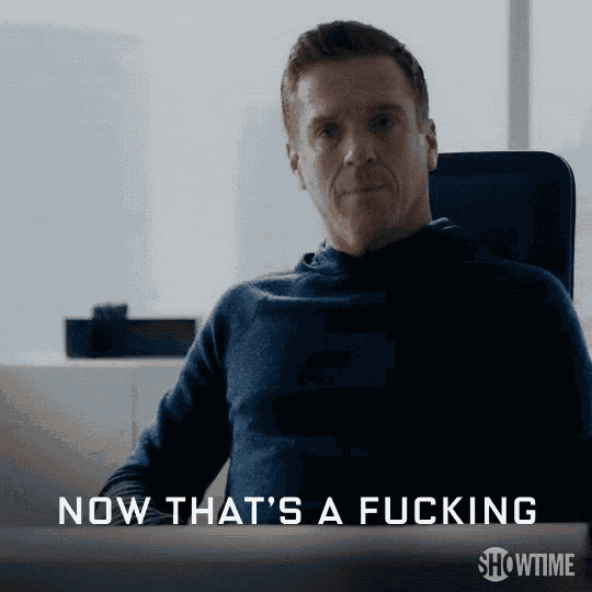 a man is sitting in a chair with the words now that 's a fucking showtime on the bottom