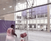 a man wearing a jersey with the number 35 on it is playing basketball