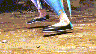 a close up of a person 's feet wearing black shoes