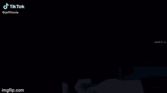 a person 's hand is glowing in the dark and says tik tok