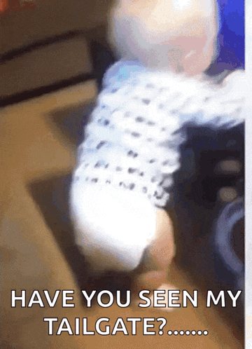 a baby is being held in someone 's arms with the caption " have you seen my tailgate ? "