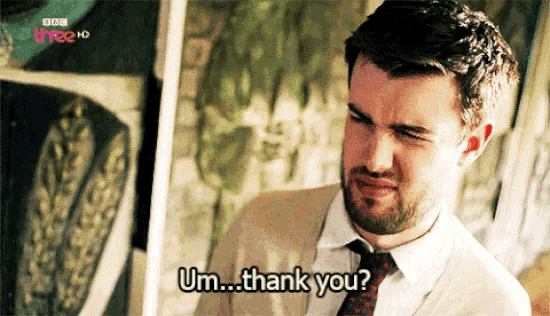 a man in a suit and tie says " um ... thank you "
