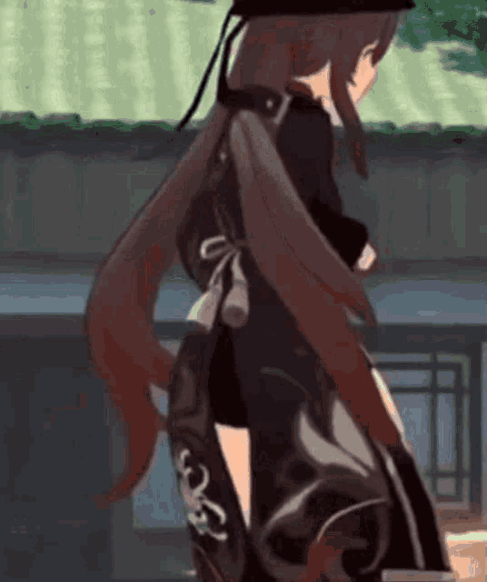 a girl with long brown hair is standing in front of a building .