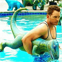 Chris Pratt With Dinosaur GIF - Dinosaur Pool Floatie GIFs