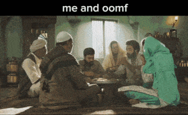 a group of people are sitting around a table with the words me and oomf above them