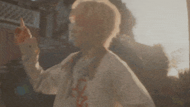 a person wearing a shirt that says msd is pointing at something