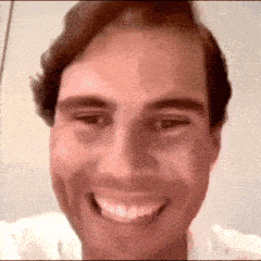 a close up of a man 's face with a smile on his face