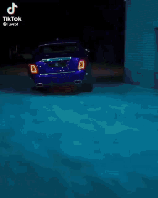 a woman wearing sunglasses and a hat is driving a car with tiktok written on the bottom