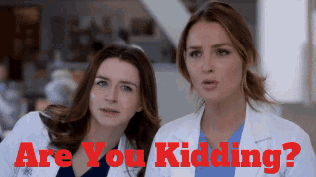 two female doctors are standing next to each other with the words " are you kidding " in red