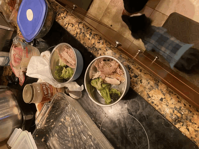 a bottle of heinz tomato sauce sits on a counter