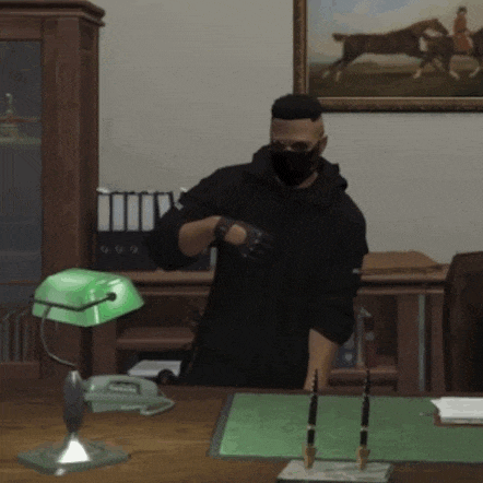 a man wearing a mask and gloves is standing in front of a green lamp
