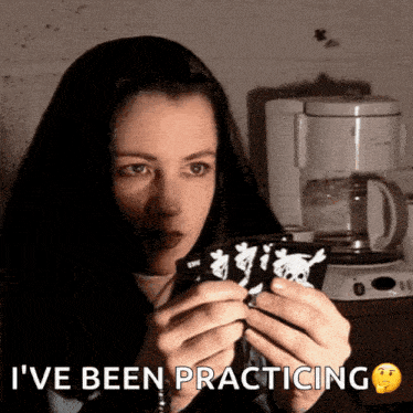 a woman holding a piece of paper with the words i 've been practicing