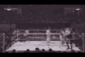 a blurry picture of a boxing match in a ring