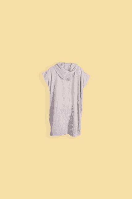 a grey hoodie is against a yellow background