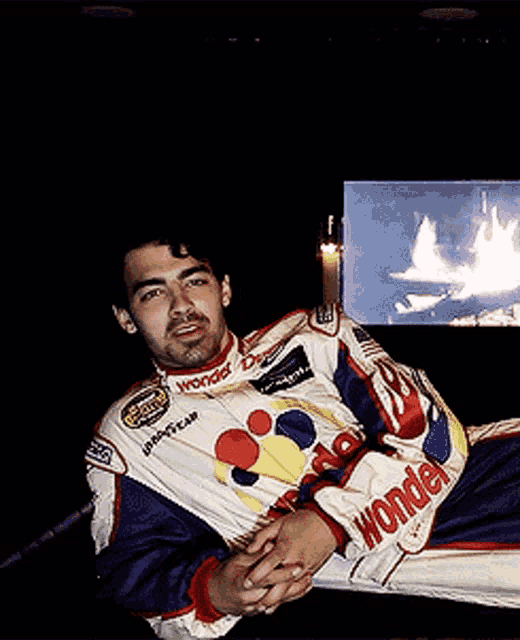 a man wearing a jacket that says wonder