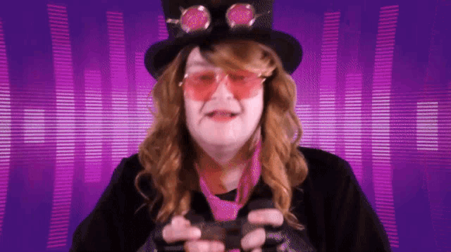 a woman wearing a top hat and pink sunglasses is holding a video game controller .