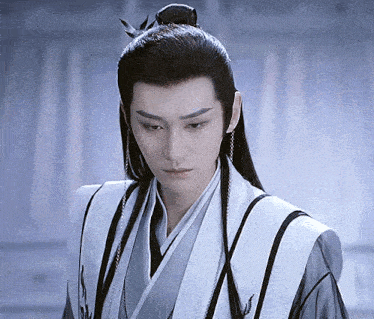 a man with long hair and a bird in his hair is wearing a kimono
