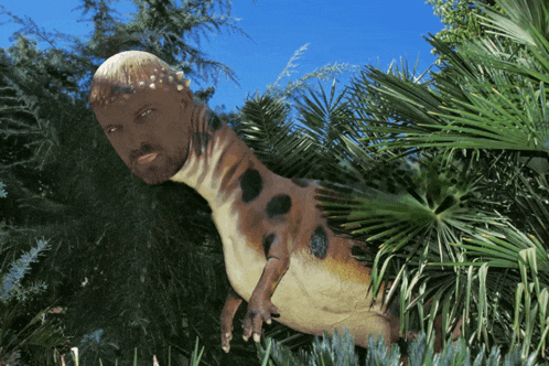 a statue of a dinosaur with a man 's head on its back