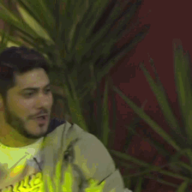 a man wearing a shirt that says ' abercrombie ' on it