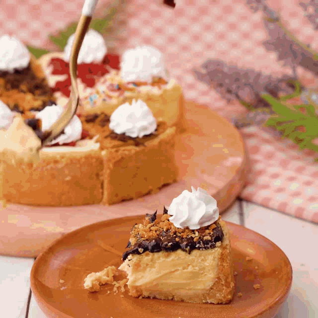 a slice of cake with whipped cream on top is on a plate
