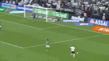 a soccer player with the number 11 on his back is walking on the field