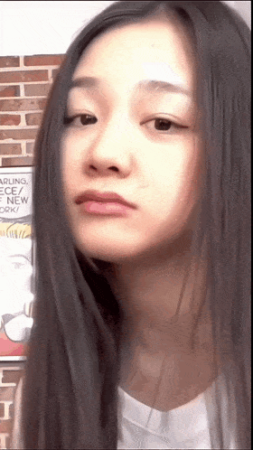 a close up of a woman 's face with a comic book behind her that says darling piece / new york