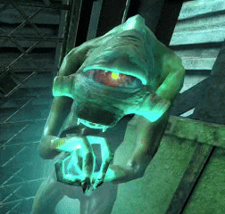 a green monster with a red eye is holding something in his hands